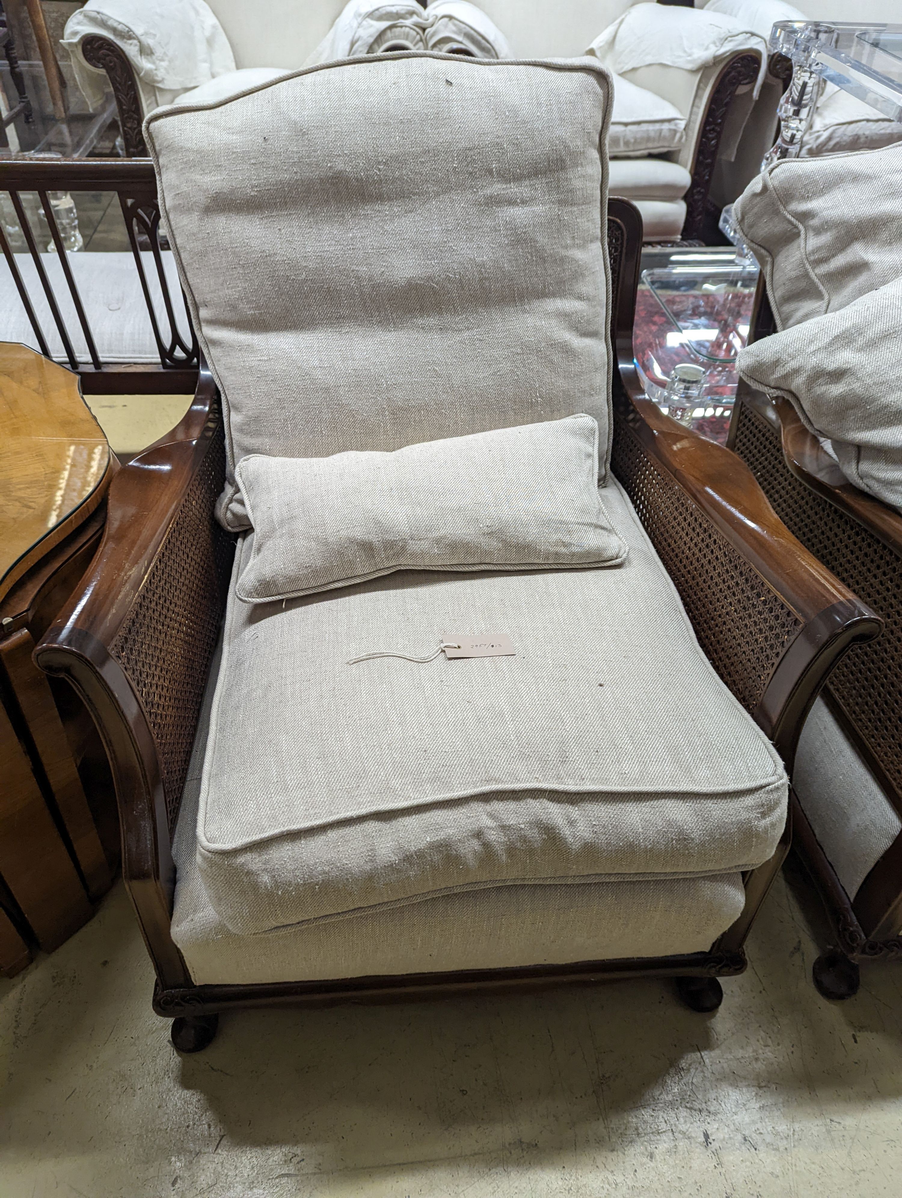 An early 20th century caned Bergere mahogany three piece suite, settee length 164cm, depth 70cm, height 70cm